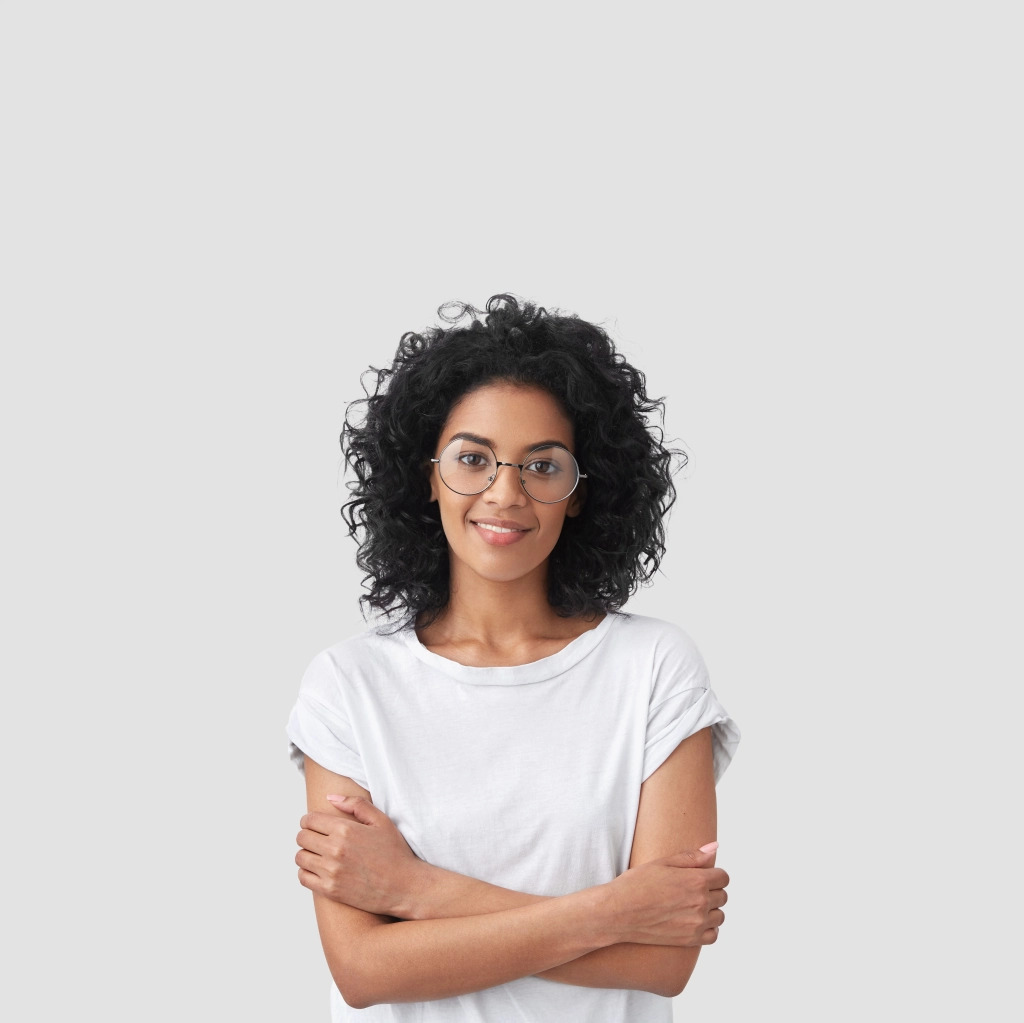 Smiling woman with curly hair in white t-shirt